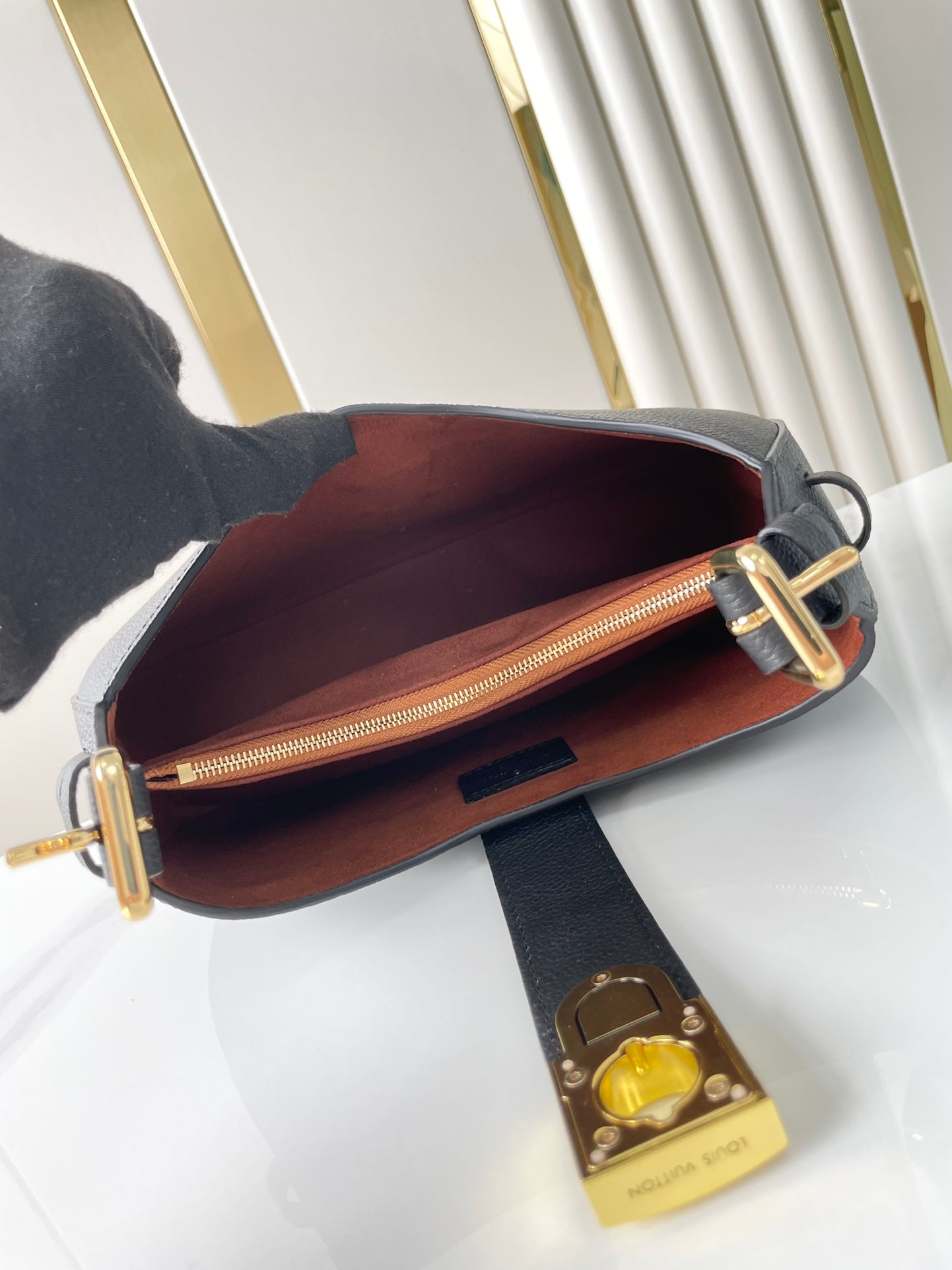 LOW KEY SHOULDER BAG 26 IN BLACK GRAINED CALFSKIN GOLD BUCKLE