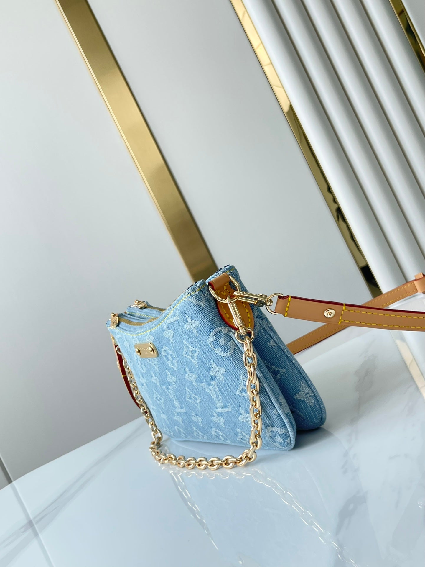 LIV POCHETTE 24 IN BLUE MONOGRAM DENIM GOLD HARDWARE