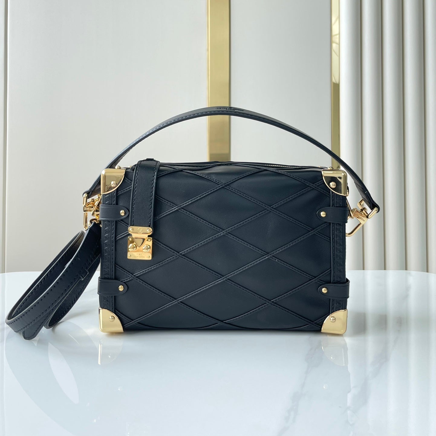 SIDE TRUNK 21 IN BLACK LAMBSKIN WITH CRISS CROSS PATTERN GOLD HARDWARE