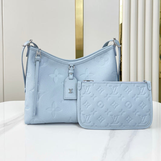 CARRYALL PM 29 IN BEAU BLUE MONOGRAM EMPREINTE LEATHER