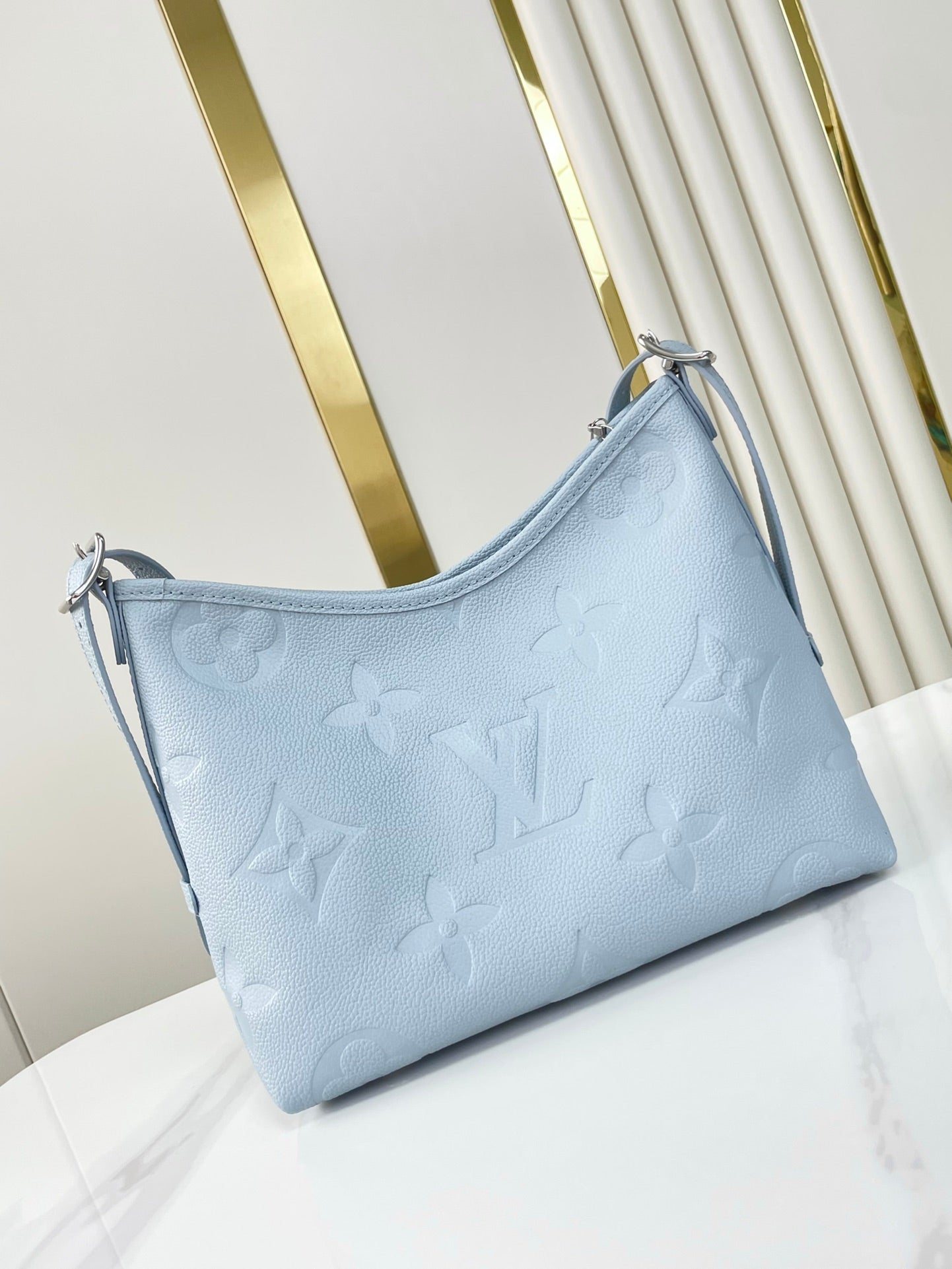 CARRYALL PM 29 IN BEAU BLUE MONOGRAM EMPREINTE LEATHER