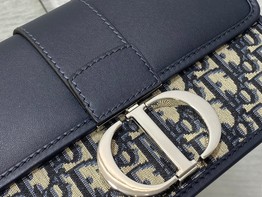 MONTAIGNE EAST-WEST 25 BAG WITH CHAIN IN NAVY BLUE LAMBSKIN AND MONOGRAM JACQUARD