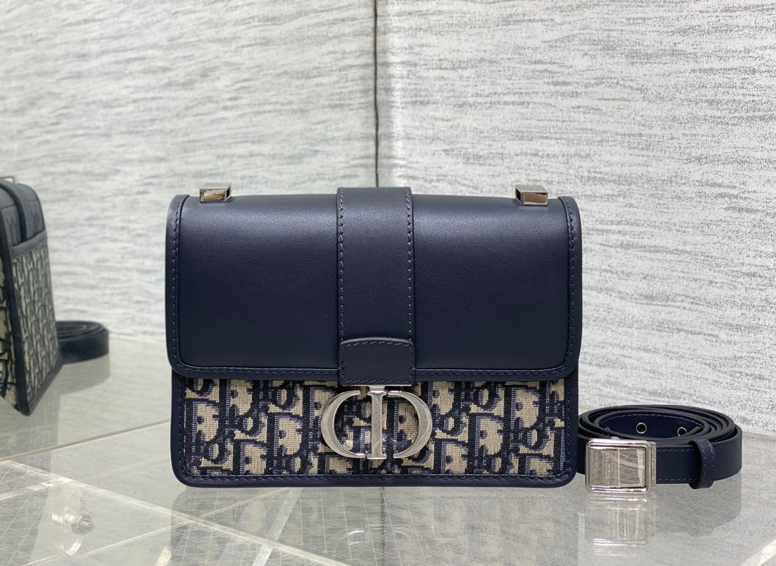 MONTAIGNE EAST-WEST 21 BAG WITH CHAIN IN NAVY BLUE LAMBSKIN AND MONOGRAM JACQUARD