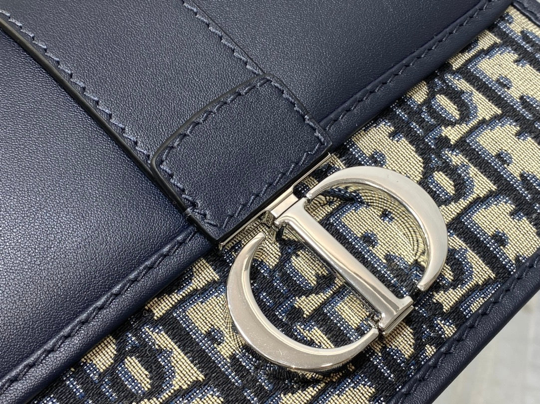 MONTAIGNE EAST-WEST 21 BAG WITH CHAIN IN NAVY BLUE LAMBSKIN AND MONOGRAM JACQUARD