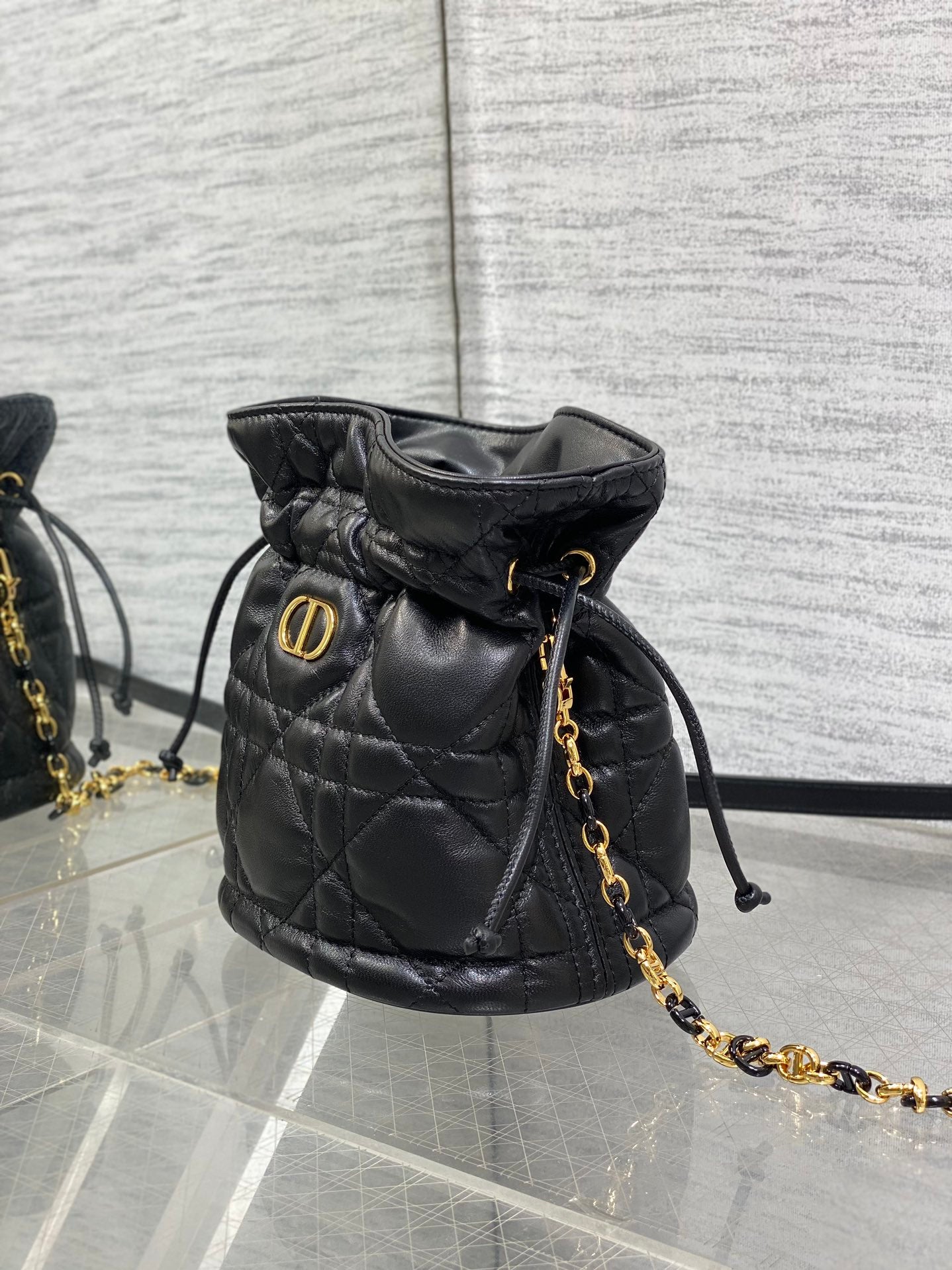 MONTAIGNE MINI 18 BUCKET BAG WITH DRAWSTRING IN BLACK LAMBSKIN