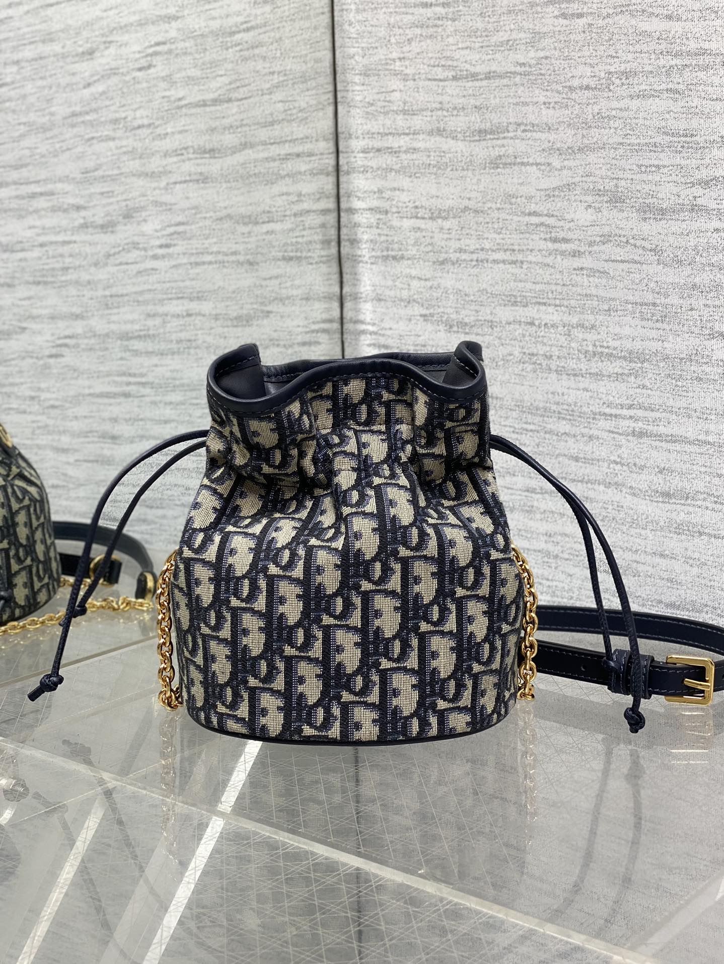 MONTAIGNE MINI 18 BUCKET BAG WITH DRAWSTRING IN BLUE OBLIQUE JACQUARD