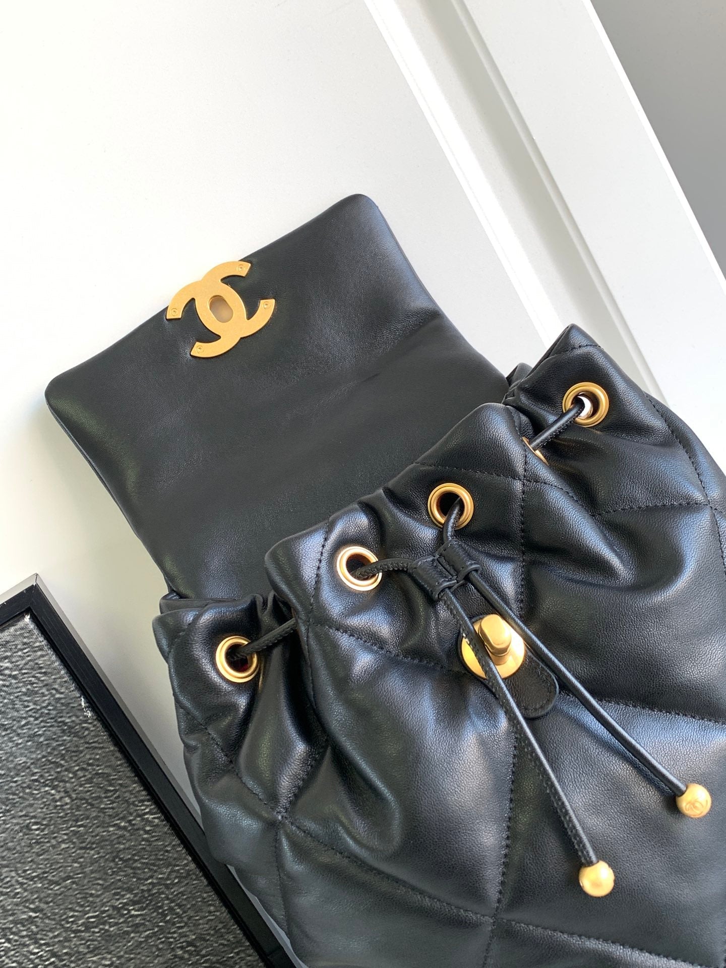 CC BACKPACK 26 IN BLACK CALFSKIN WITH GOLD HARDWARE